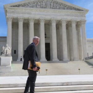 Larry Couch walking up steps to Capitol Hill