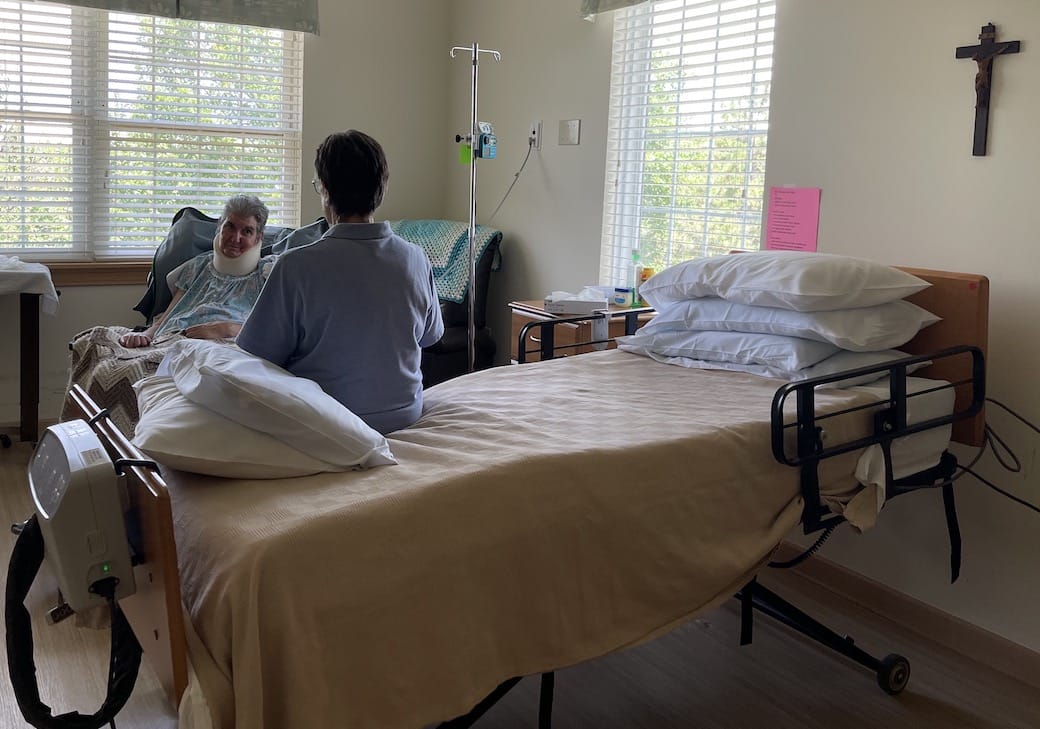 Sister Madeleine sitting on bed across from Sister Mary Carolyn