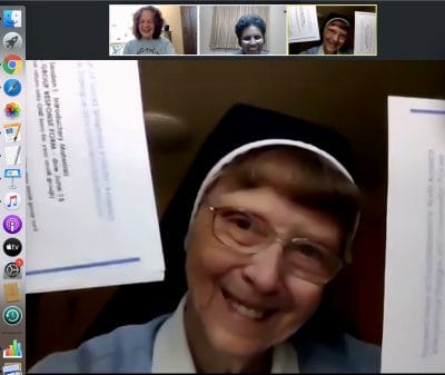 Sister Sharon Rose holds documents